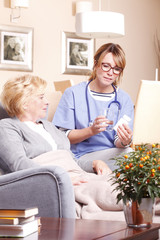 Obraz premium Elderly patient and caregiver