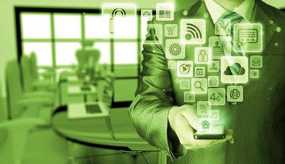 Business man using smart phone with social media icon set