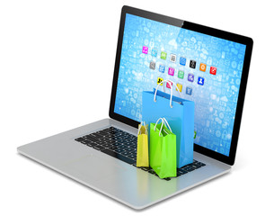 laptop and  shopping pags on white background