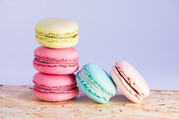series Colorful and tasty French cookies Macarons on a colorful