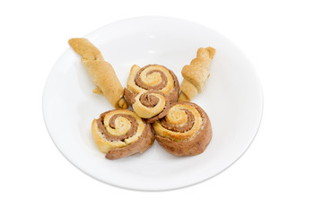 Several various sweet rolls on white dish