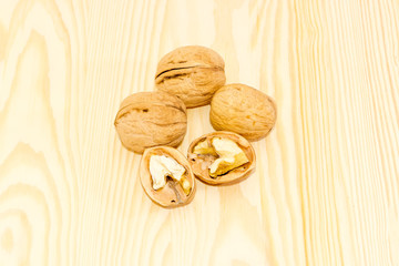Several walnuts on a wooden surface