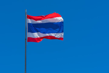 Thai flag of Thailand with blue sky background