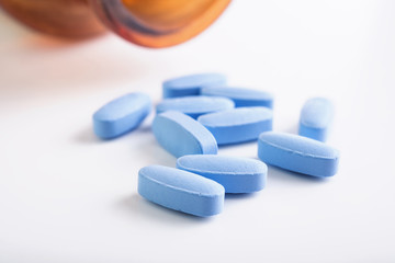 Blue pills on white