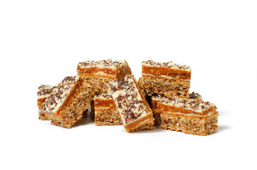 close-up of a group of eight pieces of delicious nutcakes, with white frosting and chocolate sprinkels ontop