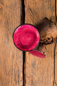 Fresh juice beetroot on wooden table 