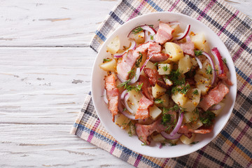Potato salad with bacon and onions. horizontal top view
