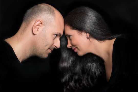 Couple in love looking to each other in profile