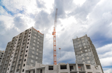Fototapeta na wymiar Housing development and hoist crane