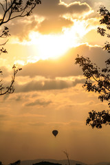 Balloon silhouette with sunset background.
