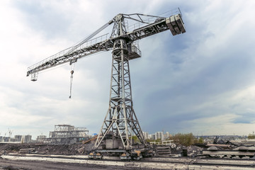 Fototapeta na wymiar Residential development and high-rise crane