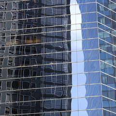 abstract image of modern office building facade with reflections