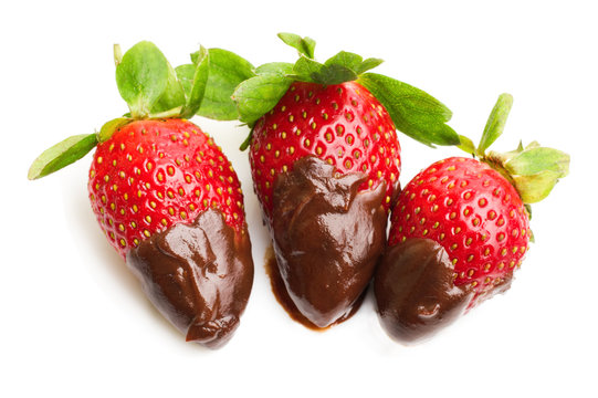 strawberries dipped in delicious chocolate isolated on the white background