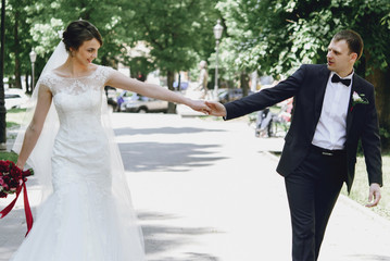 gorgeous happy luxury brunette bride and elegant stylish groom w