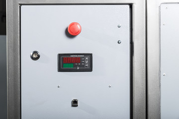 Door with red button, controller and ethernet socket.