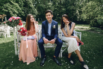 elegant stylish happy guests and bridesmaid waiting for a weddin