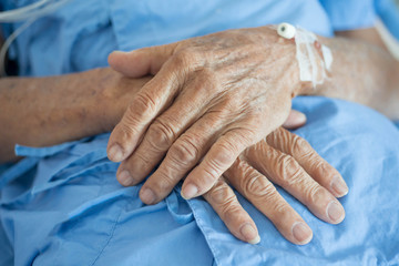 old man hand sleeping in a hospital
