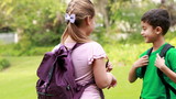Smiling pupils discussing together 