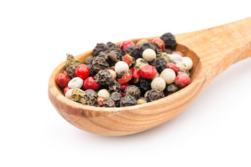 Spice in spoon on white background