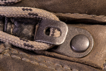Detail of trekking shoes hook and loop for the strap.