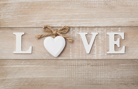 Love wooden text on vintage board background with copy space