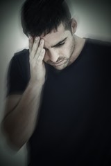 Fototapeta premium Man with headache holding his head with hand