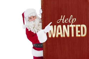 Composite image of smiling santa claus pointing poster 