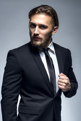 Handsome Man With Beard In Black Suit  