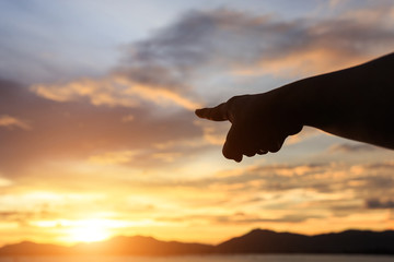 Silhouette of people hands on sky background