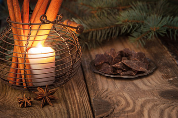 Candle with  chocolate ,spices  and fir tree