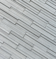 Pattern of grey and rough granite wall texture, background