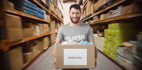 Volunteer holding clothes donation box 