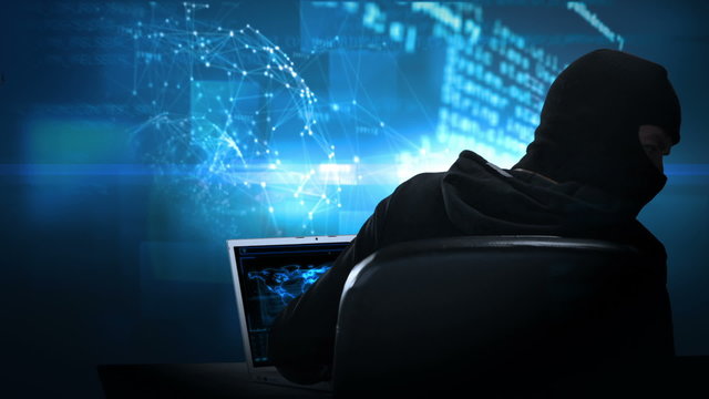 Composite video of hacker using laptop