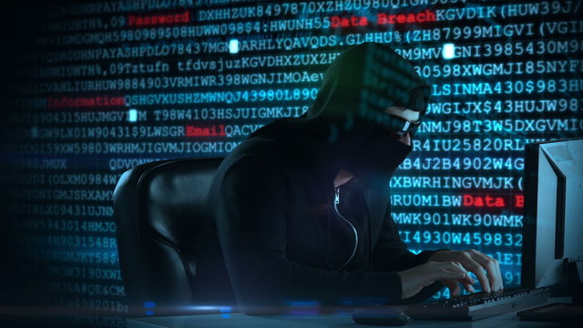 Composite video of hacker using laptop