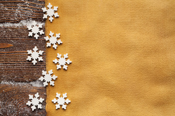 Christmas background - blank handmade paper sheet and snowflakes
