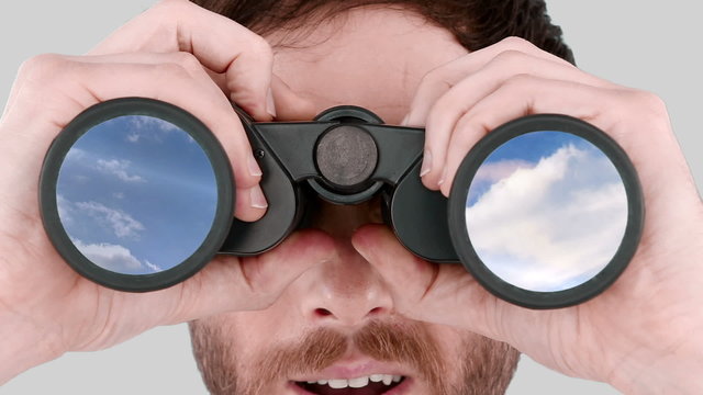 Man looking through binoculars 
