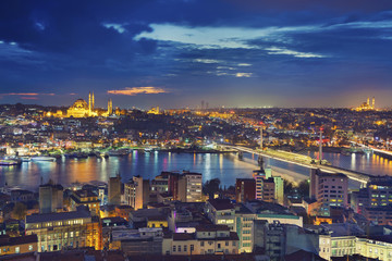 Fototapeta na wymiar Istanbul. Image of Istanbul with Suleymaniye Mosque and Golden Horn Metro Bridge during twilight blue hour.