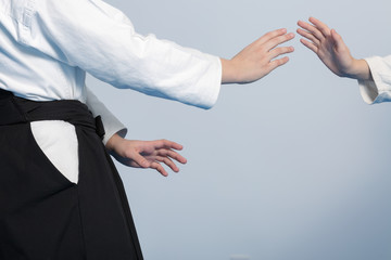 Hands of two girls standing in stance on martial arts training
