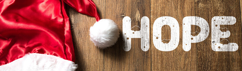 Hope written on wooden with Santa Hat