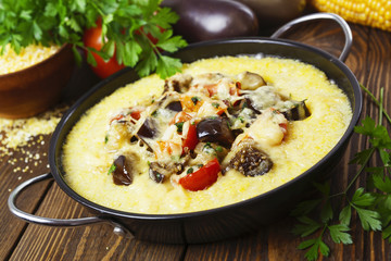 Polenta baked with vegetables and cheese