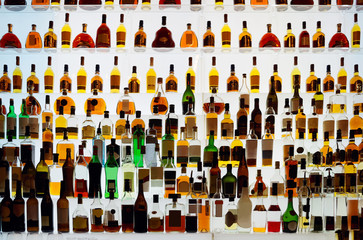 Various alcohol bottles in a bar