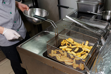 Chef is cooking french fries