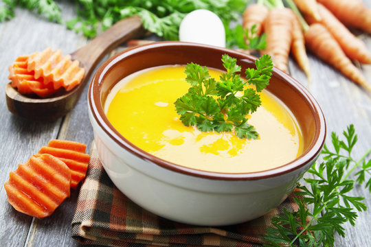 Carrots soup in the ceramic pot