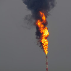 Blast of fire from oil refinery stack