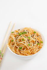 Sesame noodles on white background