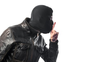 Robber making silence gesture