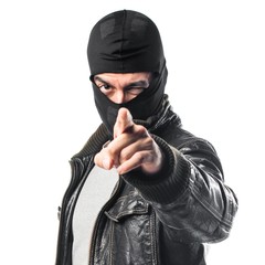 Robber pointing to the front