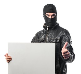 Robber holding an empty placard