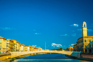 Obraz premium View of old street and river Arno in Pisa city, Italy