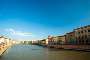 View of old street and river Arno in Pisa city, Italy